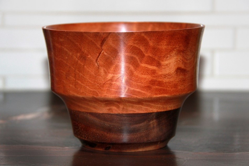 Vase of bubinga, with a walnut base.